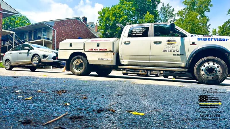 Trucks working an apartment parking enforcement call